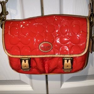 COACH Peyton Papaya Embossed
Patent Leather Crossbody Purse
Traveler Small